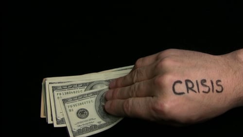 Hand with Crisis Tattoo Pushing Money