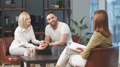 Couple Receives Counseling in a Modern Urban Office