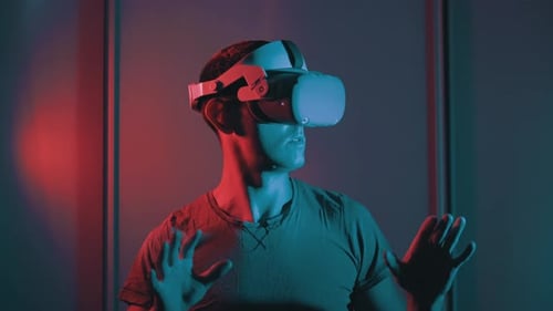 Young Adult Man Wearing VR Headset Indoors