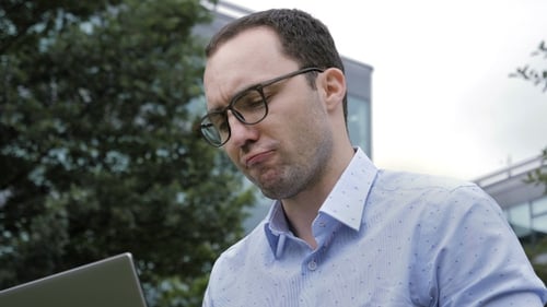 Man Working on Laptop Outdoors, Close Up
