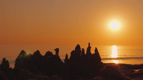 The Sun Goes Over the Towers of the Sand Castle