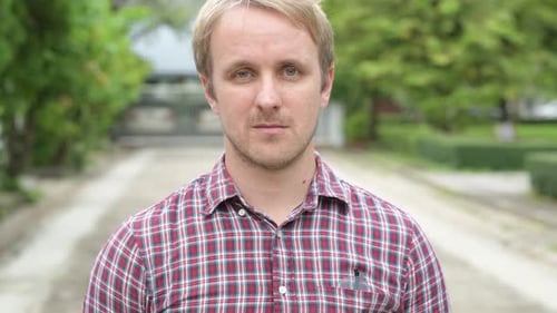 Close-up of a man in a plaid shirt