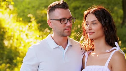 Portrait of Happy Young Couple at Summer Park