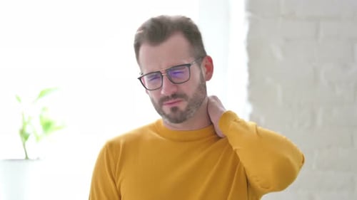 Portrait of Man Having Neck Pain