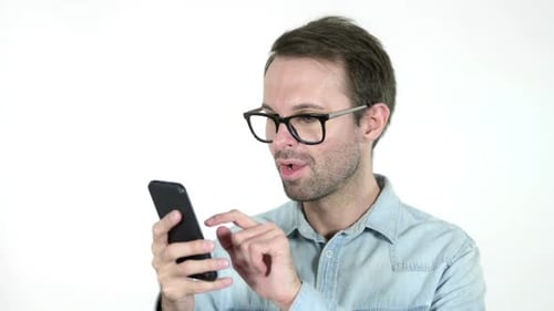 Excited Adult Man Celebrates While Using Smartphone