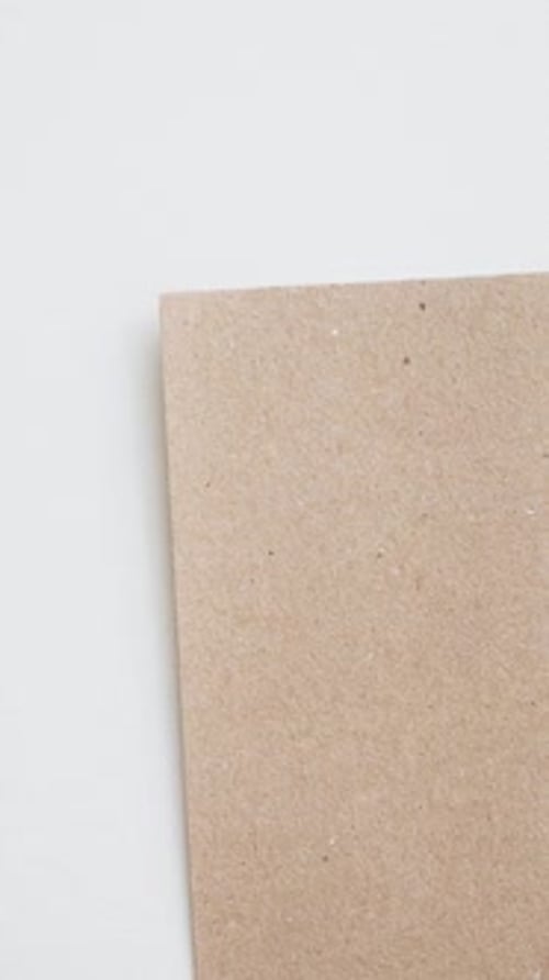 Writing Number Two on Cardboard with Red Pen