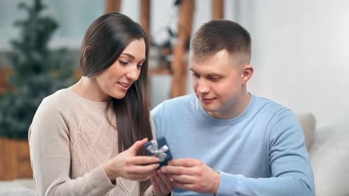 Couple Looking at Gift Together