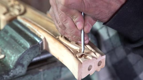 Hands Carving Wood With Chisel Close Up