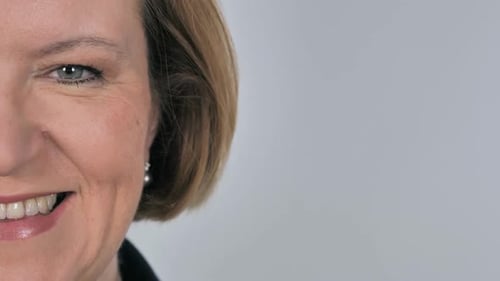 Extreme Close-Up of Smiling Adult Woman's Face