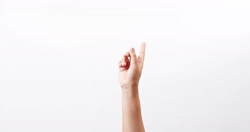 Close up of a woman making gestures with one arm with touching on a white studio background with cop