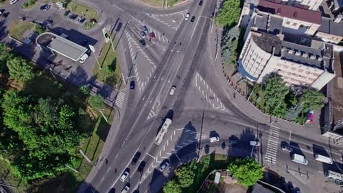 Traffic Cars Driving on a Road Intersection Crossing in City