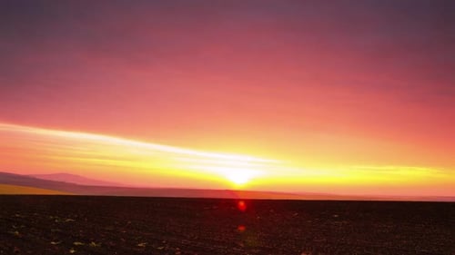 Sunrise over a Plowed Field