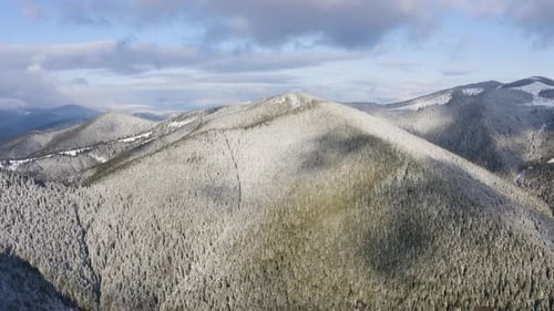 Aerial Drone View Above Mountain Snowy Forest. Amazing Winter Landscape