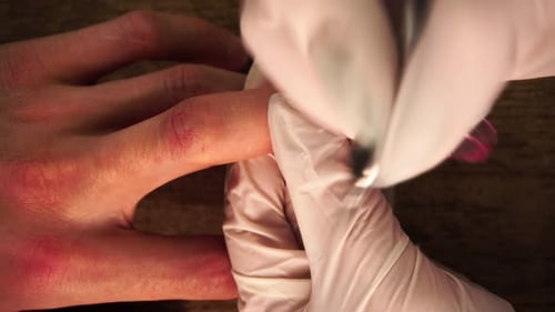 Macro Footage From Above of Female Master Cleaning Cuticle and Polishing Nails By Frame