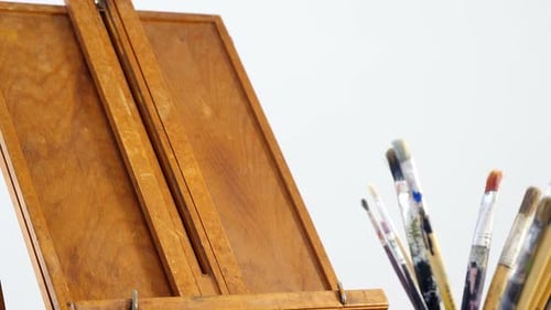 Close-Up of Wooden Easel and Paintbrushes