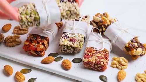 Energy granola bars with different seeds, nuts and dried fruits and berries.