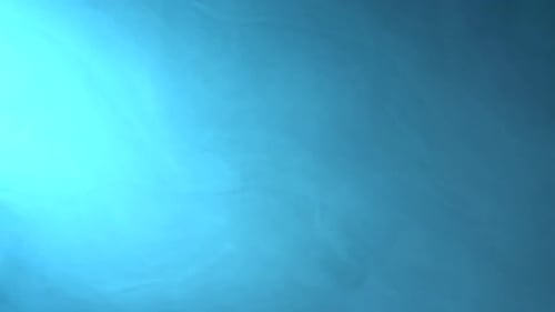 Smoke Floats in Space. Bright Blue Background.