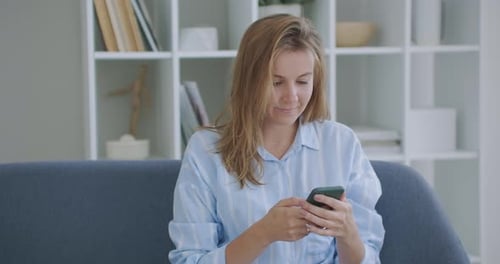 Portrait of Happy Business Woman Enjoy Success on Mobile Phone at Home Office. Closeup Joyful Girl