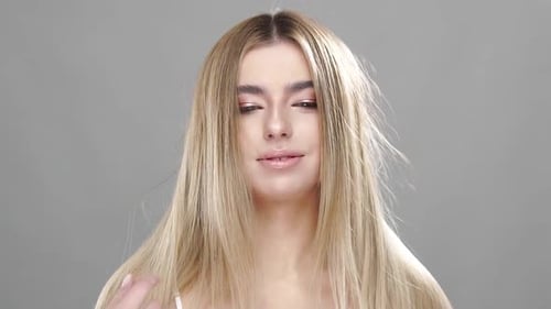 Cute Girl Touching Her Luxury Blonde Hair