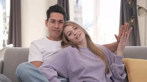 Affectionate Couple Relaxing on Couch at Home