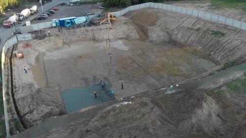 A pump pouring concrete at the construction site