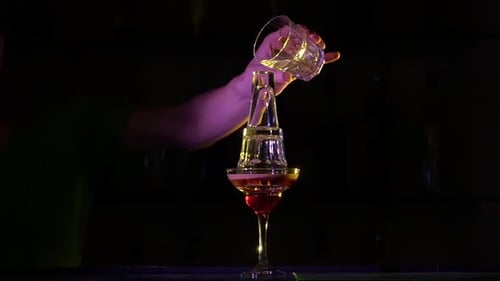 Bartender Pouring Flaming Cocktail in Urban Bar