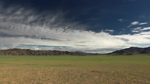 Green Flat Plain Next to Treeless Hills