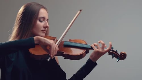 Girl Violin Playing at Studio, Woman Is Practicing Playing Musical Instrument
