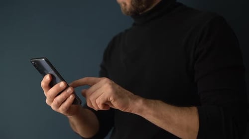 Person Using a Mobile Phone with Touchscreen