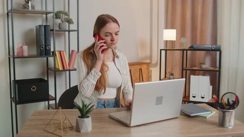 Young Woman Using Laptop Computer Sitting on Sofa Working Online Shopping From Home Office