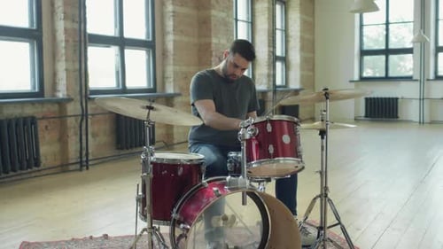 Drummer Playing Drums in Music Rehearsal Studio