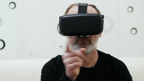 Man Using VR Headset Interacting with Virtual World