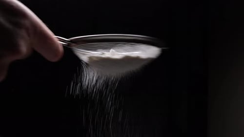The Chef Sifts Flour Through A Sieve To Prepare Dessert