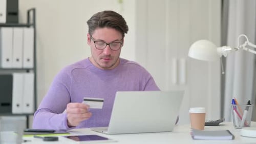 Man Frustrated with Online Shopping Using Credit Card