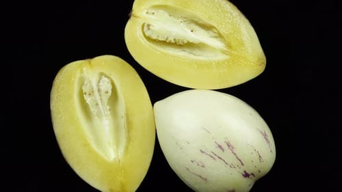Close Up of Whole and Halved Pepino Melons