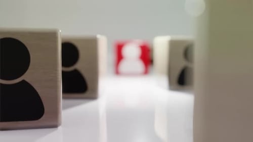 3D Person Icons on Cubes Highlight a Standout Individual