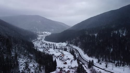 Aerial View of idyllic high-rise touristic place in Carpathian Mountains, winter season.