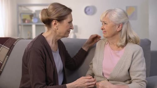 Mature Women Grieving, Hugging and Supporting Each Other, Farewell Sadness