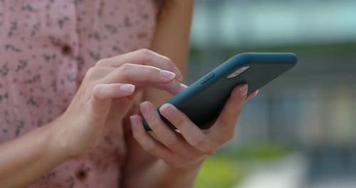 Woman Using Phone in City, Close Up