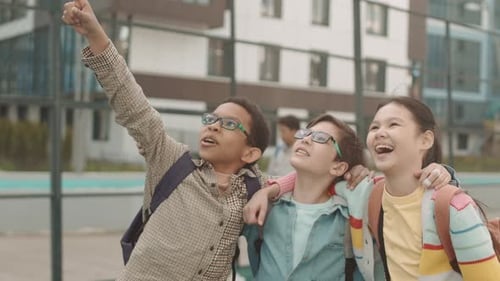 Children Pointing at Sky and Laughing