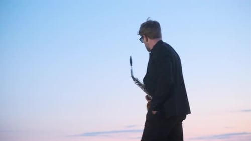 Saxophone Player at Sunrise