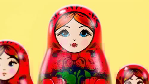 Traditional Matryoshka Dolls Animated Reveal on a Yellow Background