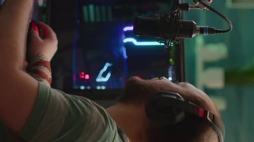 Gamer Using Mouse and Colorful Computer Equipment