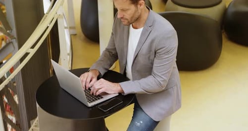 Businessman Using Laptop in Office 4k