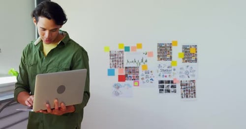 Colleagues Working Together on Project at Workplace