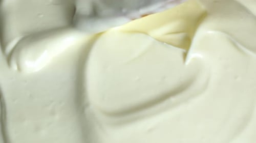 Thick Creamy Texture Being Smoothed with a Spatula