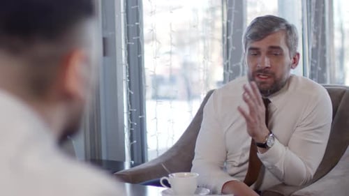 Businessmen Talking in Urban Setting