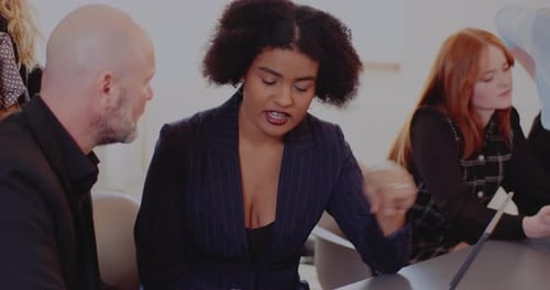 Multiracial Colleagues Discussing at Office