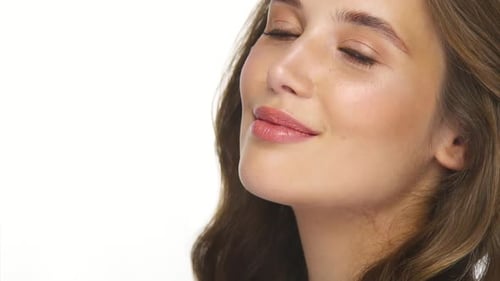 Close-up Portrait of Charming Young Girl with Perfect Hair Isolated on White