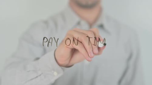 Man Writes Pay on Time With Black Marker
